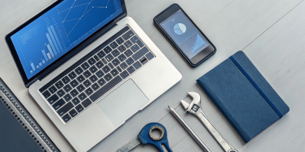 Laptop on a desk showing the best inventory management software that integrates with QuickBooks.